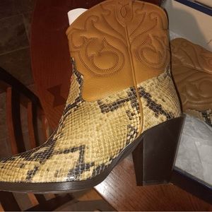 Snake skin booties, made in Portugal.